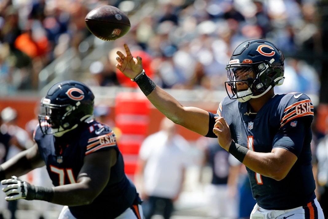 CHICAGO, IL - AUGUST 14: Chicago Bears quarterback Justin Fields (1) throws  the football during a pre-season game between the Chicago Bears and the  Miami Dolphins on August 14, 2021 at Soldir