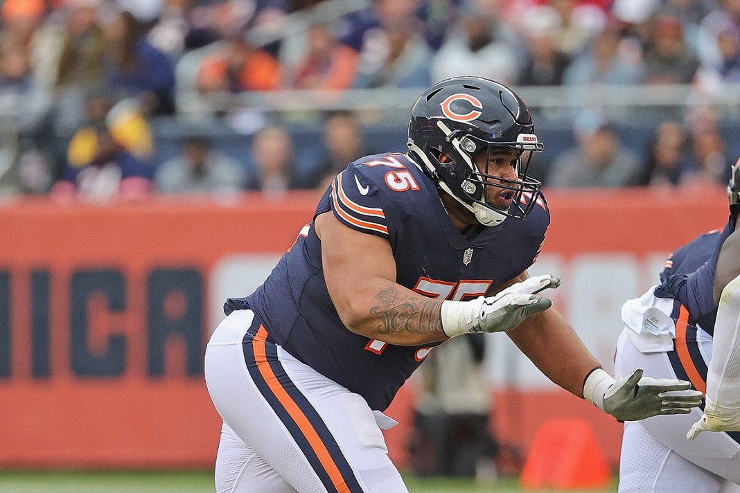 Chicago Bears tackle Larry Borom (75) runs off the field at halftime of an  NFL football game against the New England Patriots, Monday, Oct. 24, 2022,  in Foxborough, Mass. (AP Photo/Stew Milne