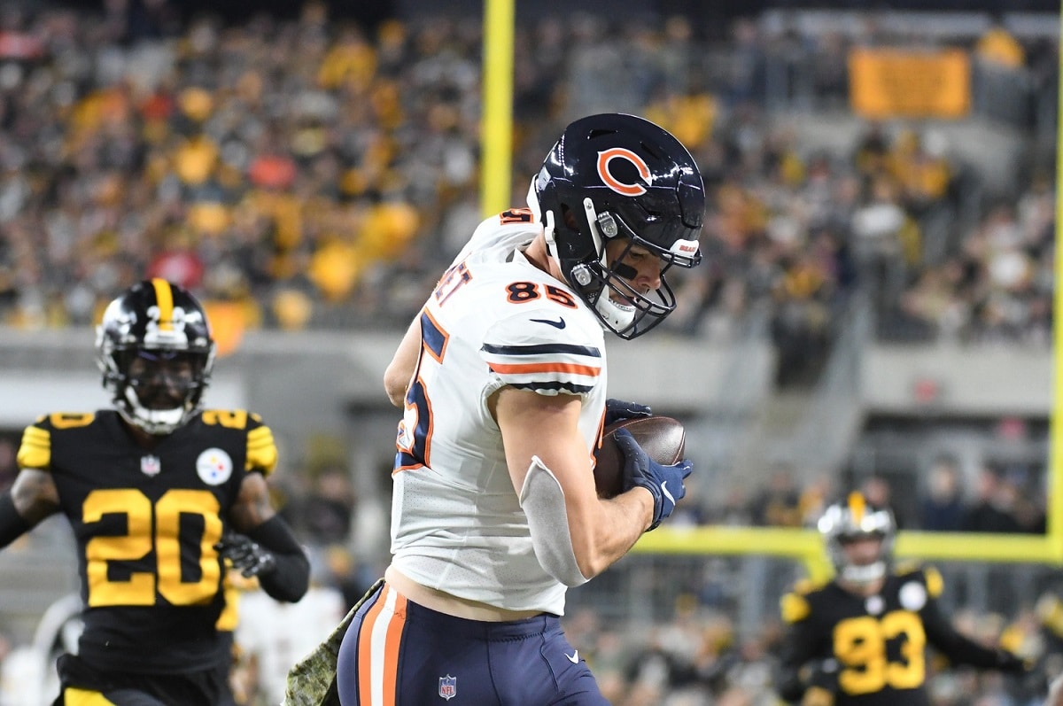 Chicago Bears quarterback Justin Fields twists body for sidearm completion  to tight end Cole Kmet to move chains